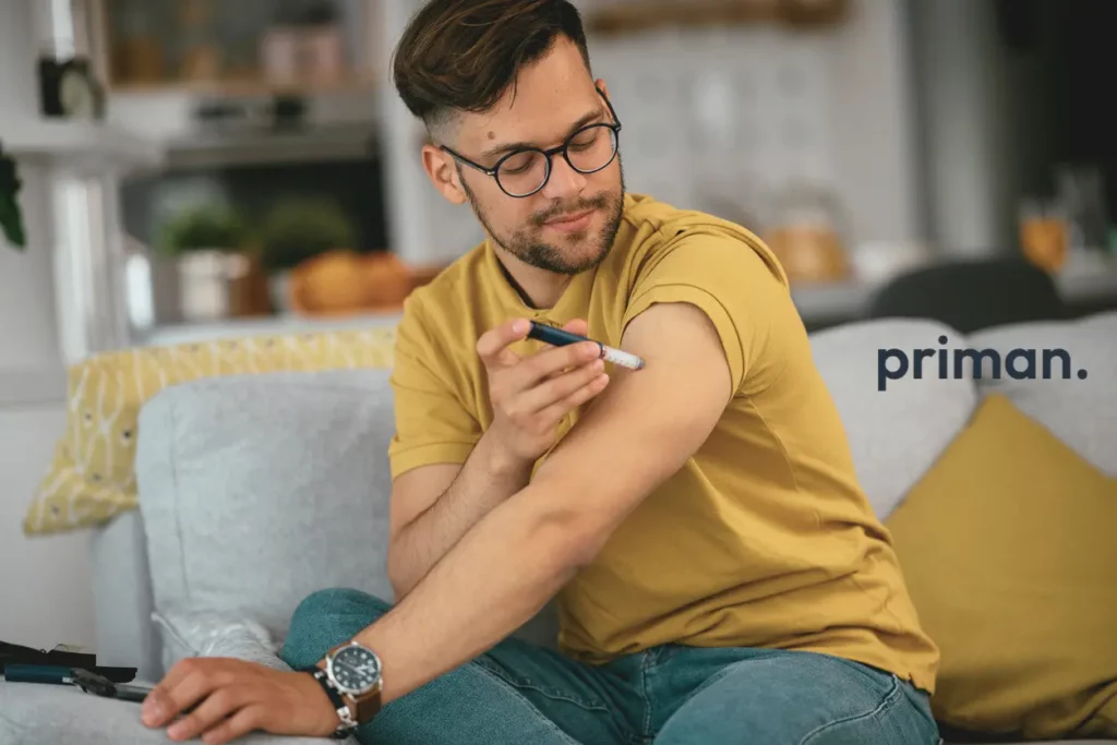 Young man giving himself a weight loss injection